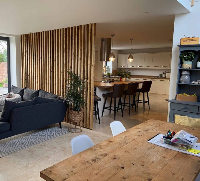 Reclaimed timber room divider installed in a bright open-plan kitchen