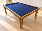 Big Blue reclaimed wood gaming table with a blue recessed playing surface in a bright Scandinavian room.