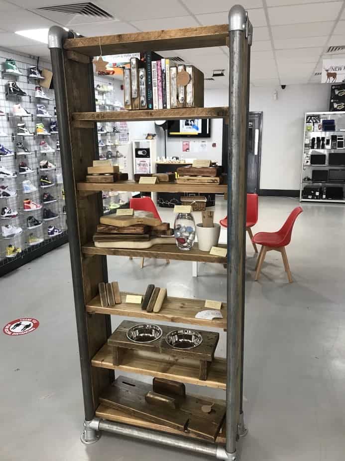 Reclaimed-wood shelving and display furniture inside a shop
