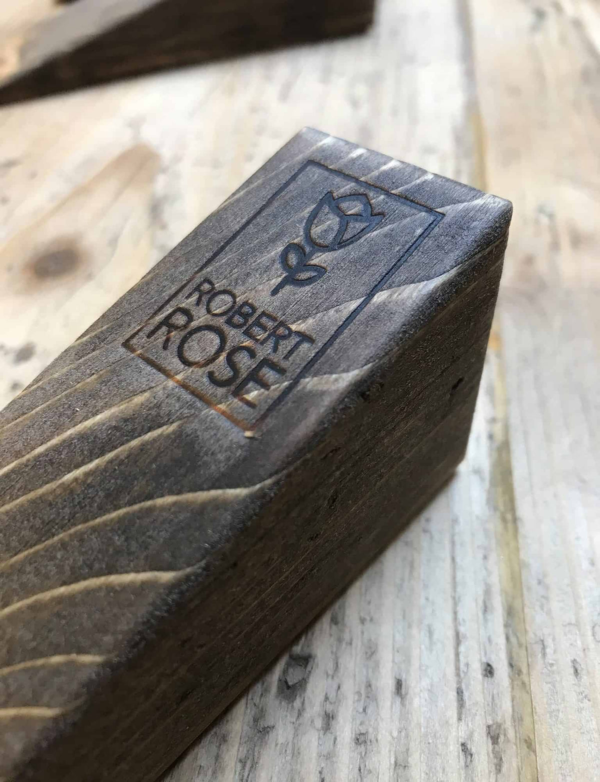 Robert Rose Carpentry mark branded into reclaimed wood