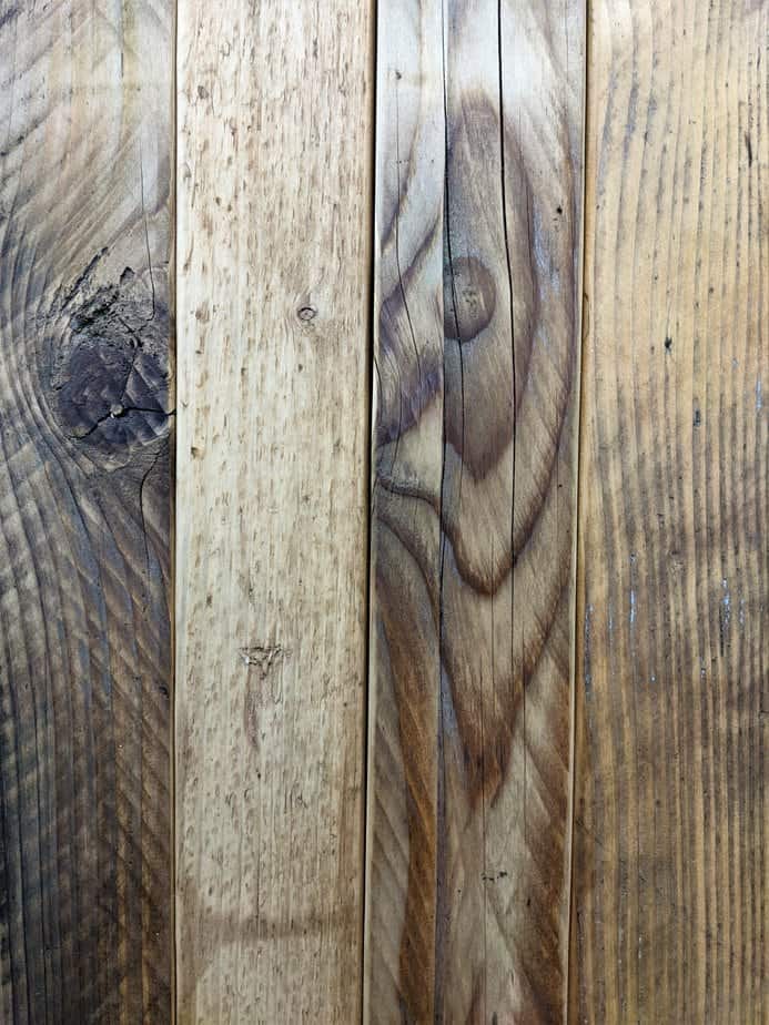 Selection of reclaimed wood boards in different tones and finishes