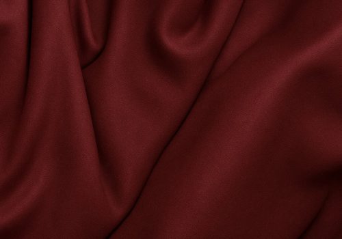 Burgundy playing fabric swatch.
