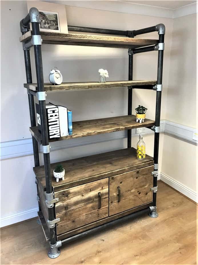 Reclaimed wood and steel pipe shelving unit with cupboard storage.