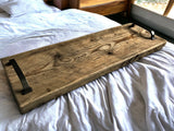 The Stoneham wooden bed tray on a bed